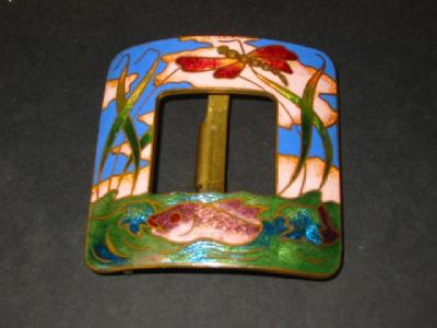 Appraisal: A CLOISONNE BUCKLE of curved square form enamelled with a