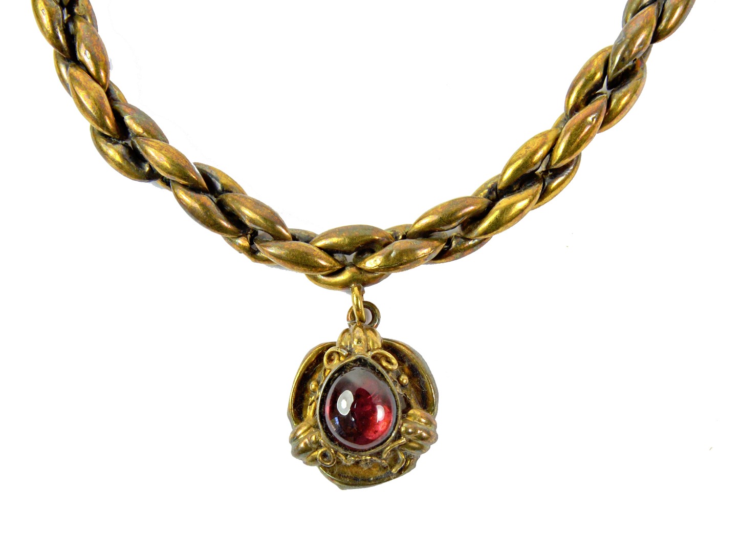 Appraisal: A Victorian hollow gold chain-link bracelet with cabochon garnet pendant