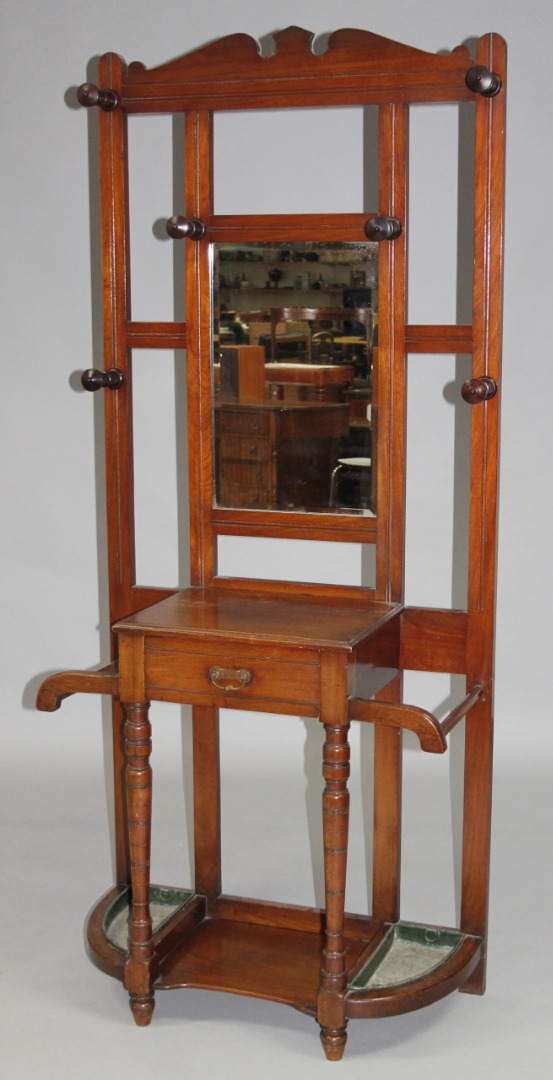 Appraisal: An Edwardian mahogany hall stand with mirror back flanked by