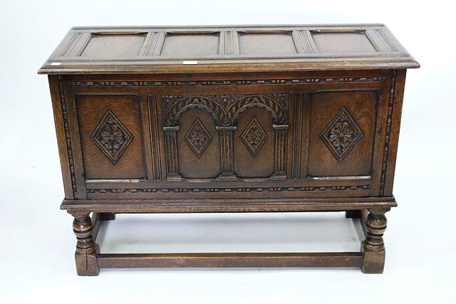 Appraisal: AN OAK PANELLED BLANKET BOX with arcaded carved front and