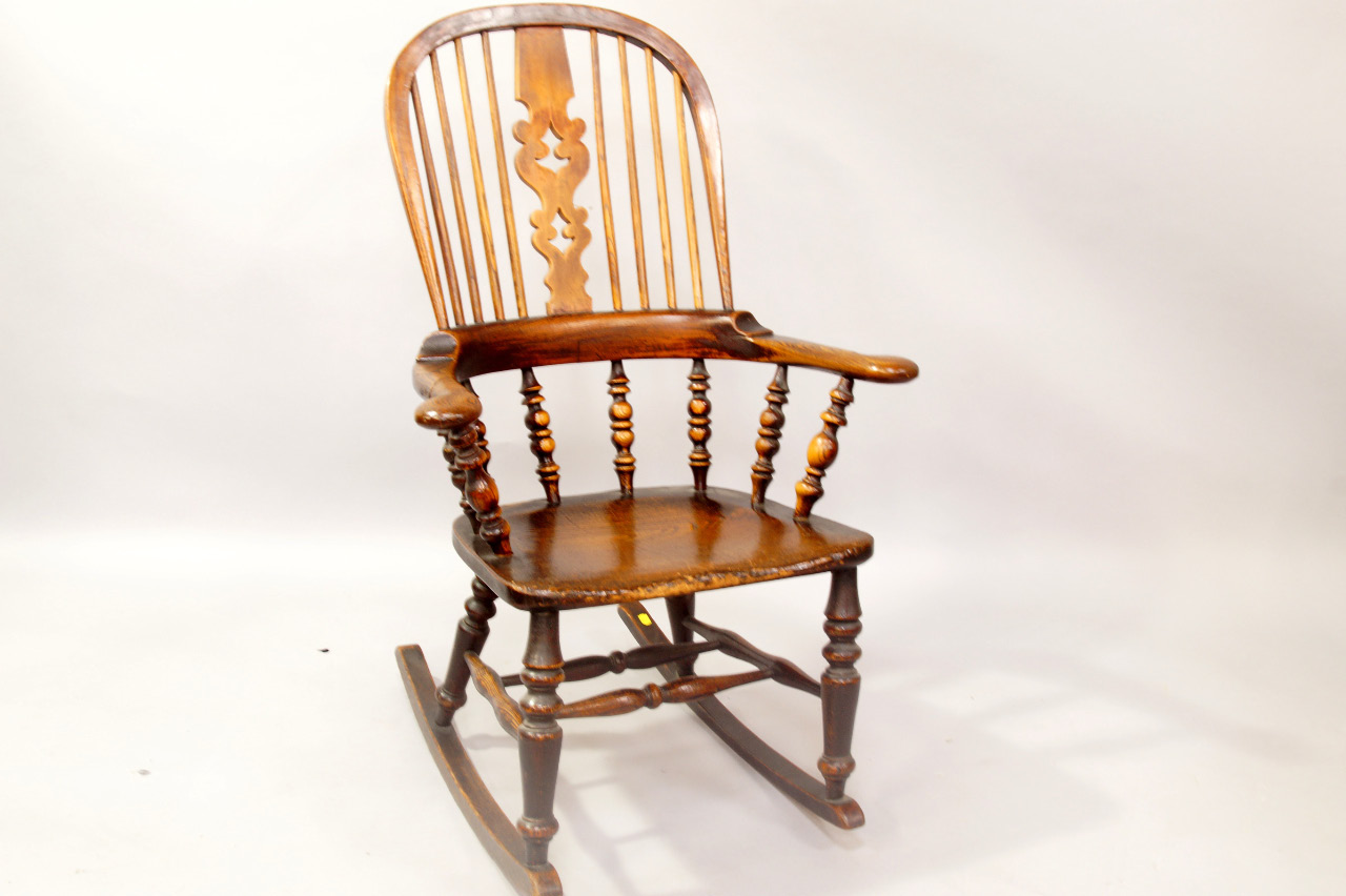 Appraisal: A thC ash and elm rocking grandfather chair with Christmas