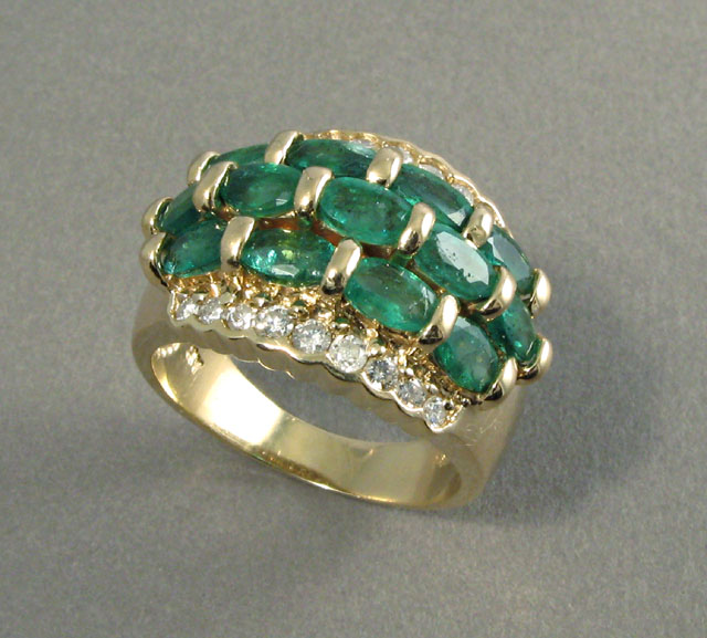 Appraisal: EMERALD DIAMOND AND YELLOW GOLD RING set with oval-cut green