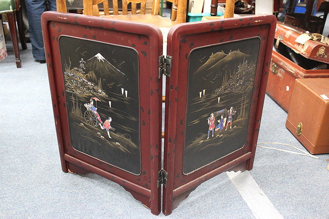 Appraisal: AN ORIENTAL RED LACQUERED TWO FOLD SCREEN cm wide together