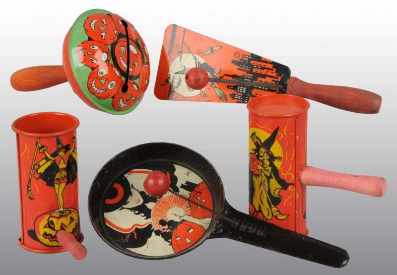 Appraisal: Lot of Tin Halloween Noisemakers Description Most feature witch designs