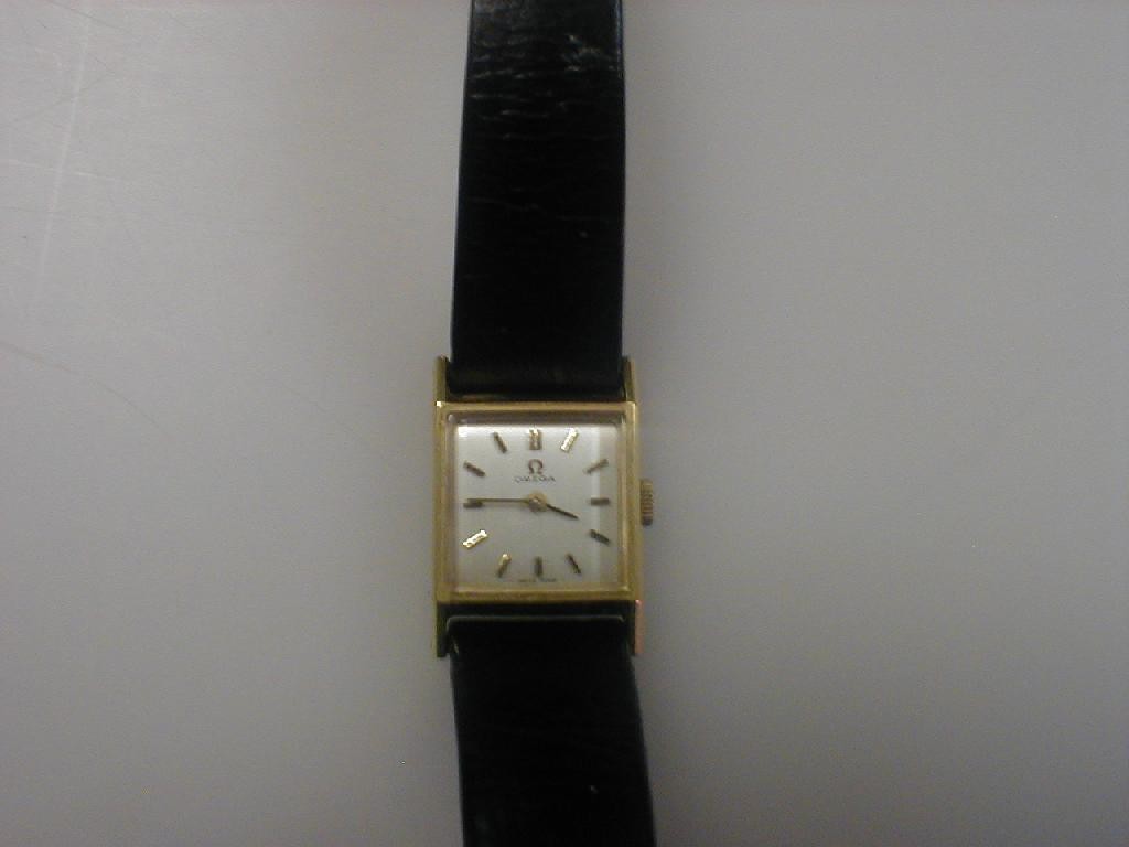 Appraisal: A ladies Omega wristwatch square dial gold plated case baton