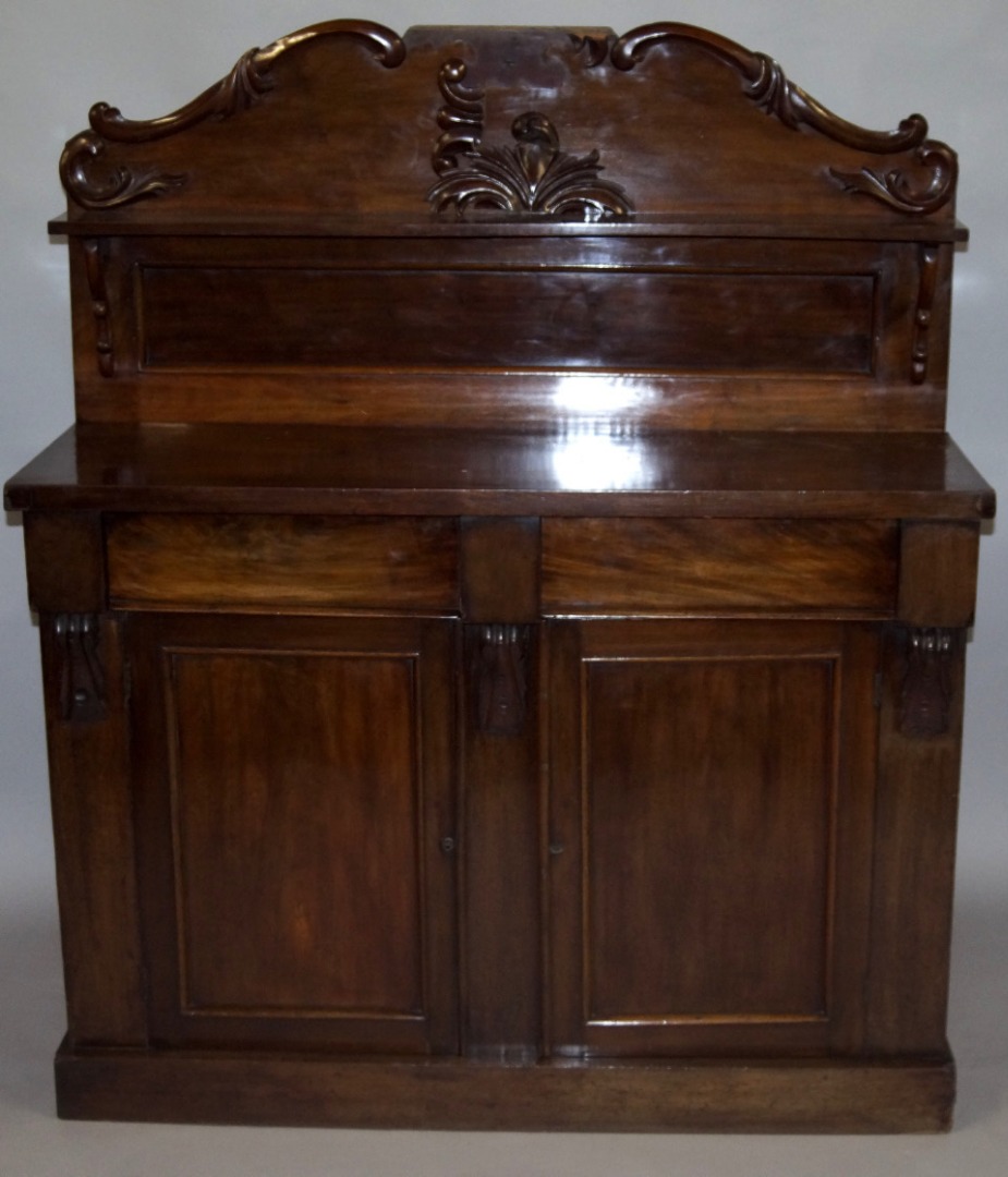 Appraisal: A Victorian mahogany chiffonier The carved back with a single