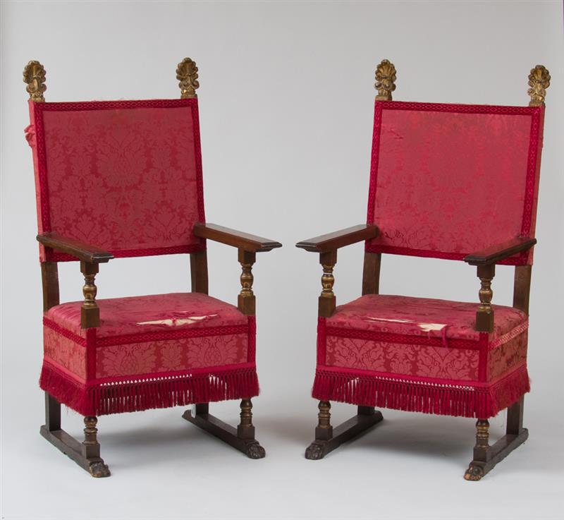 Appraisal: PAIR OF SPANISH BAROQUE WALNUT AND PARCEL-GILT TALL-BACK ARMCHAIRS Each