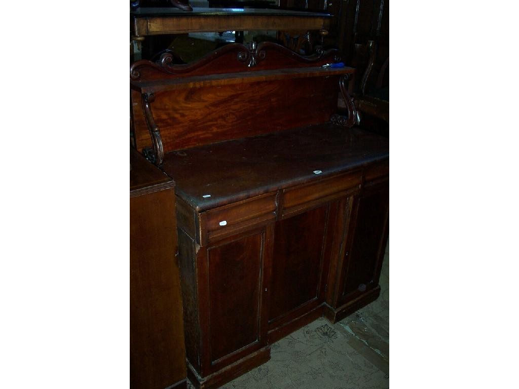 Appraisal: A Victorian mahogany chiffonier the raised upper section with shaped