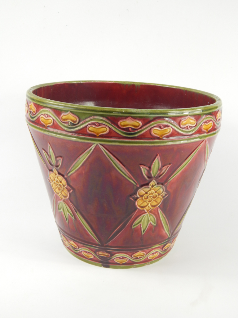 Appraisal: A Minton Secessionist pottery jardiniere decorated with flowers within bands