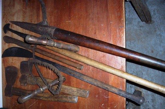 Appraisal: A barking iron and sundry tools including axes chain saw