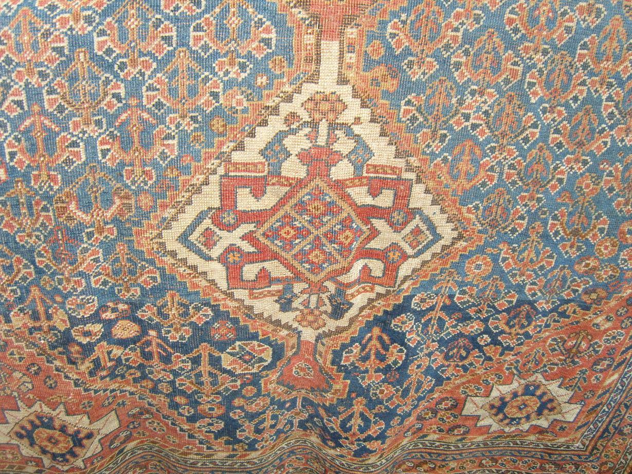 Appraisal: A blue ground eastern wool rug with geometric decoration in