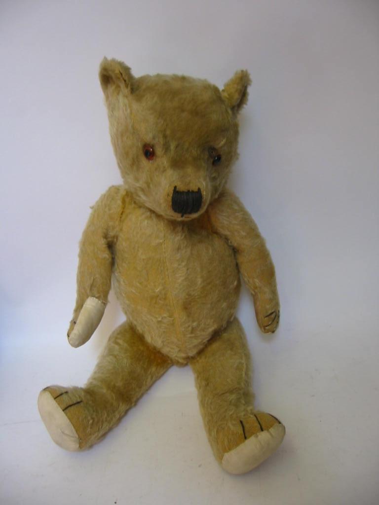 Appraisal: An English teddy bear mid th century straw filled covered