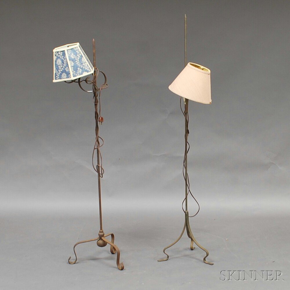 Appraisal: Two Wrought Iron Adjustable Floor Lamps th century electrified on