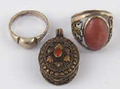 Appraisal: A mixed lot comprising two white metal rings and a