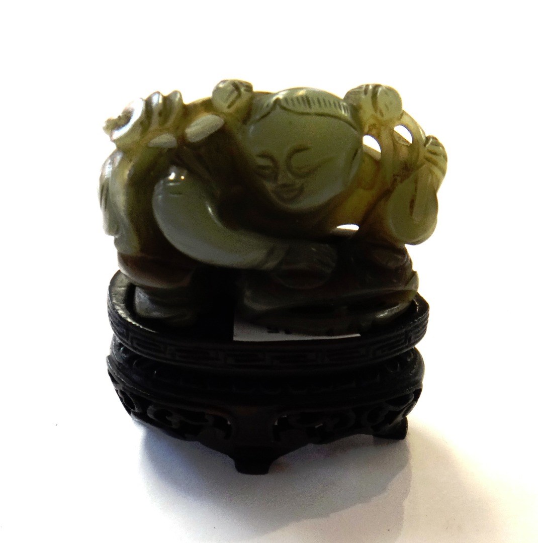 Appraisal: A Chinese jade carving over a boy crouching over a