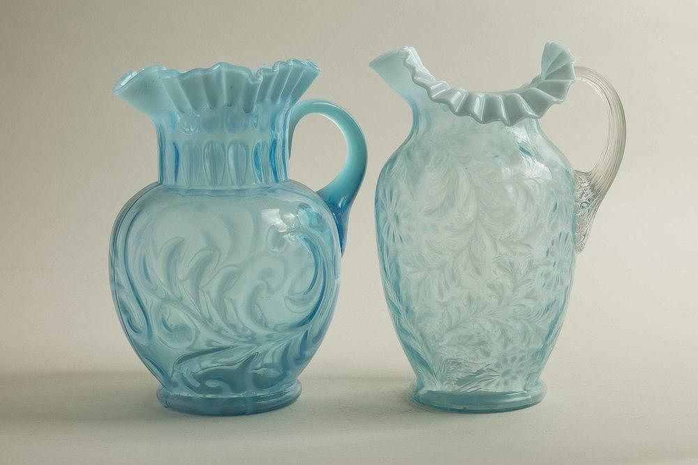 Appraisal: Two Blue Art Glass Pitchers Two blue art glass pitchers