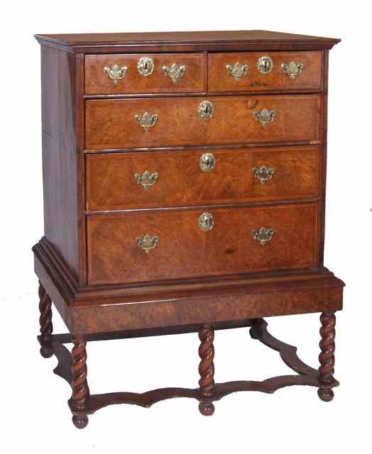 Appraisal: A BURR AND FIGURED WALNUT CHEST ON STAND fitted two