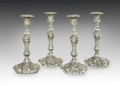 Appraisal: A set of four Victorian cast silver candlesticks baluster form