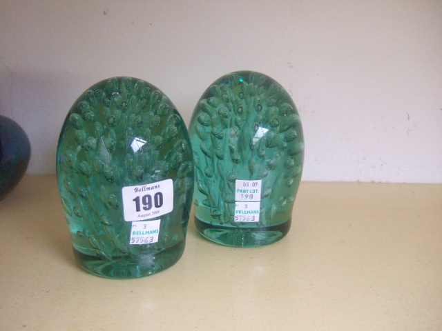 Appraisal: Two Victorian green glass dump paper weights with air bubble