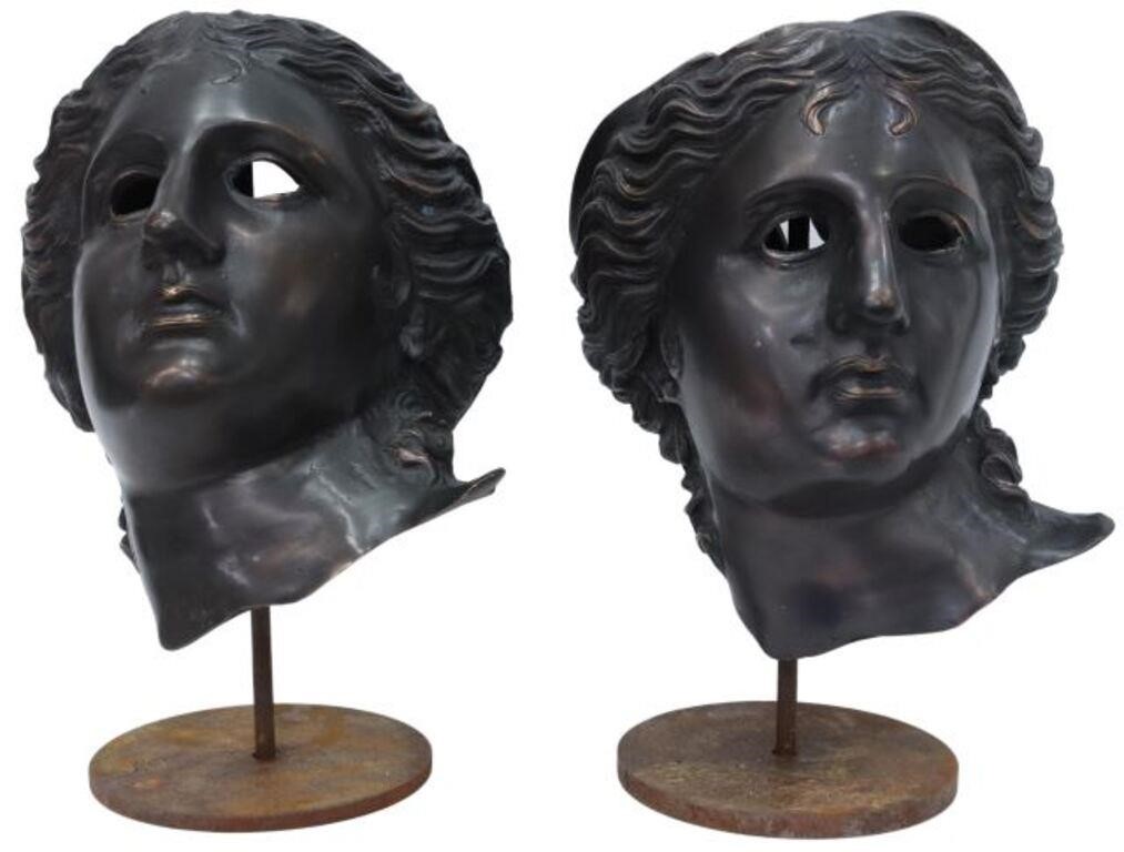 Appraisal: lot of Decorative patinated metal masks on iron display stands