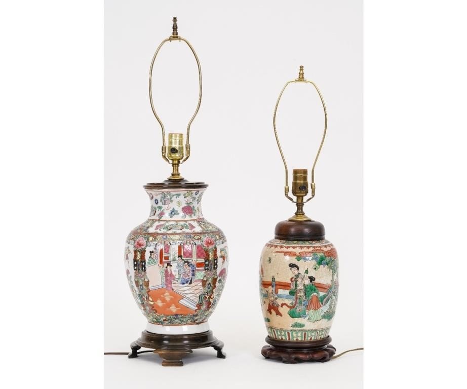 Appraisal: Two Chinese style porcelain table lamps on wood carved bases