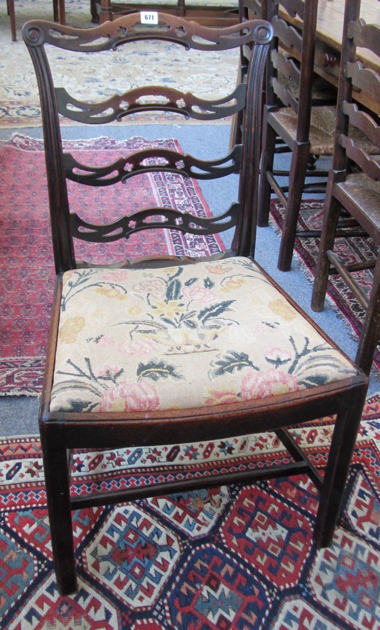 Appraisal: A pair of th century mahogany framed ribbon back dining