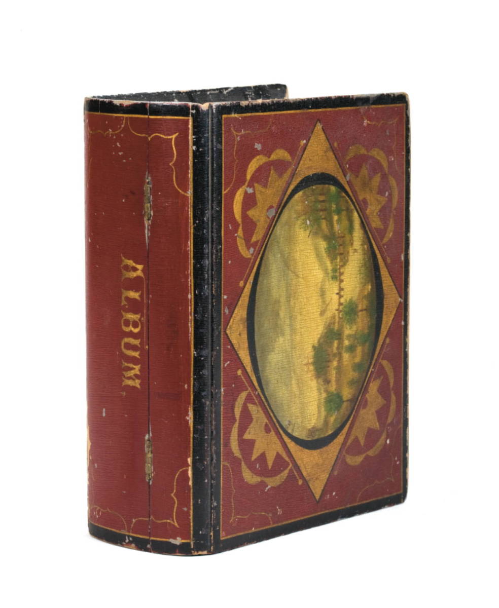 Appraisal: PAINT DECORATED BOOK-FORM BOX The top painted with a central