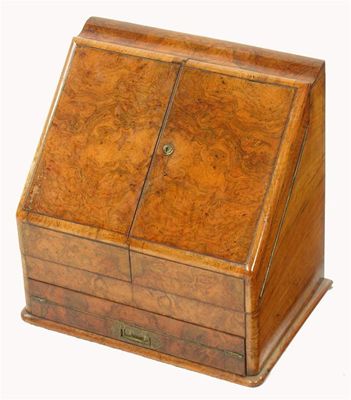 Appraisal: A Victorian walnut stationery cabinet the burr veneered hinged top