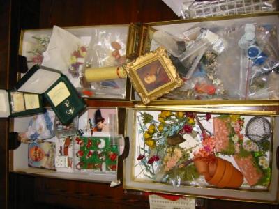 Appraisal: Four boxes of dolls house accessories including flowers trellis Christmas