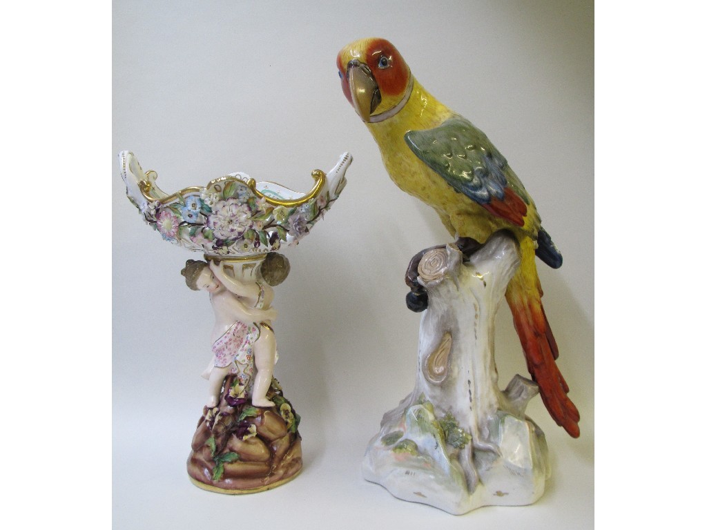 Appraisal: A German figure of a parrot perched on a gnarled