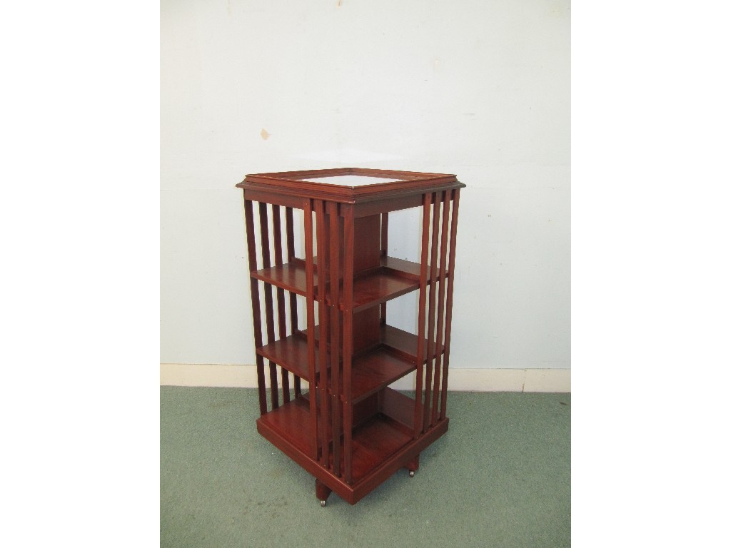 Appraisal: Edwardian mahogany revolving bookcase raised on an X form base