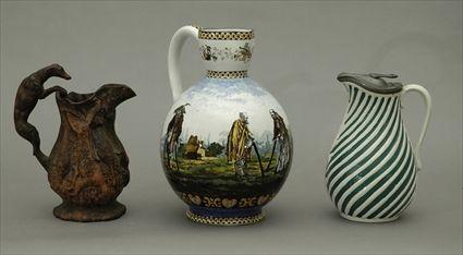 Appraisal: German Polychrome Decorated Faience Pitcher Together with a pewter-mounted stoneware