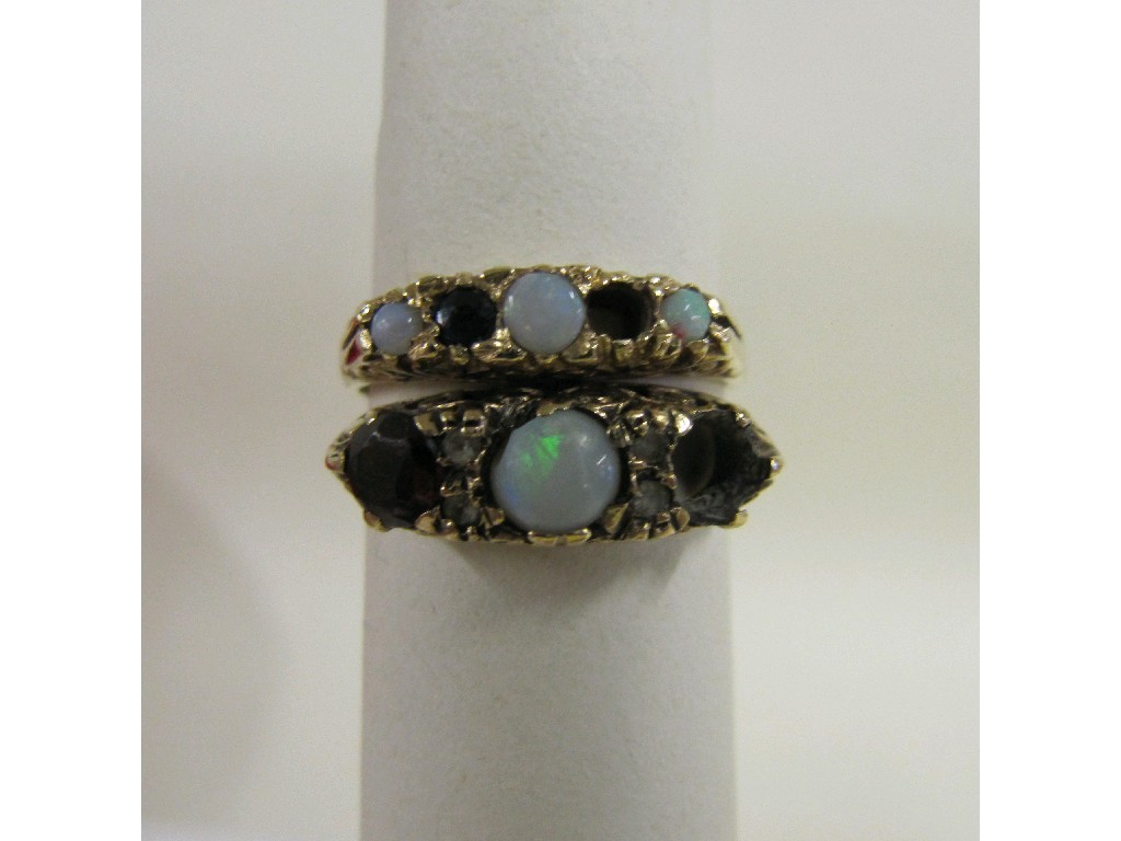 Appraisal: Two ct gold opal and garnet set dress rings stones