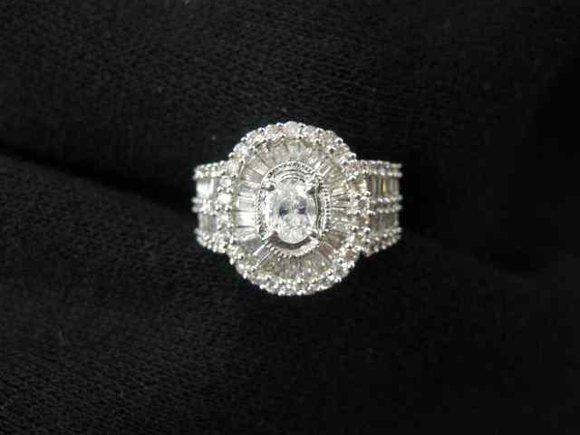 Appraisal: Diamond Ring oval center diamond carat surrounded by round baguette