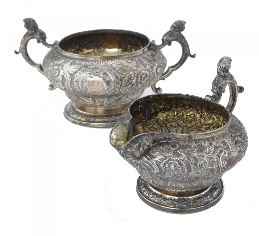 Appraisal: A GEORGE III CREAM JUG AND SUGAR BOWL of ogee