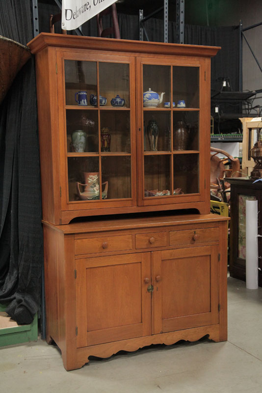 Appraisal: TWO PIECE STEP BACK CUPBOARD Walnut having a thumb molded