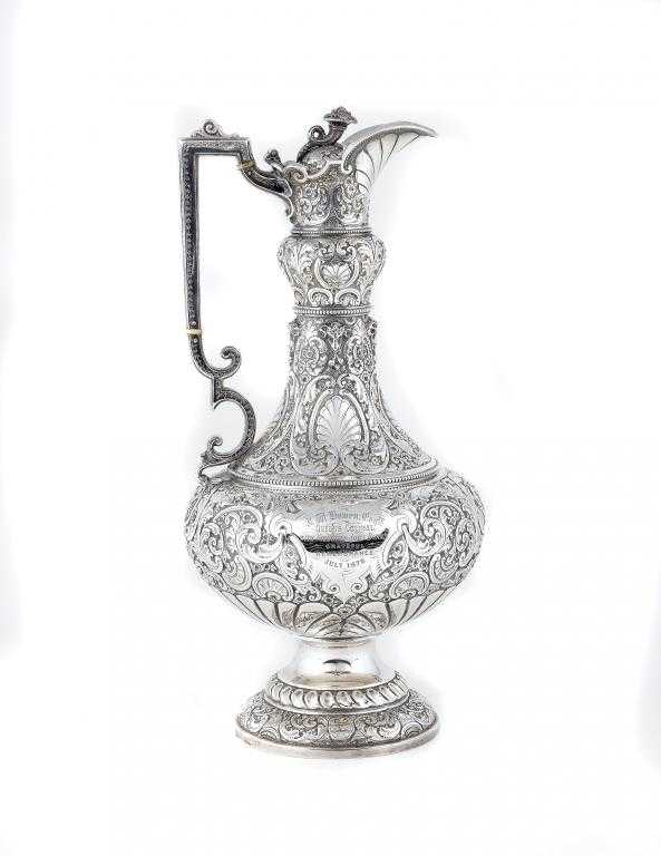 Appraisal: A VICTORIAN TESTIMONIAL EWER the flared neck and compressed body