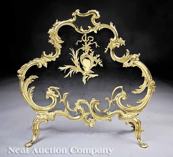 Appraisal: A Louis XV-Style Brass Fire Screen the frame adorned with