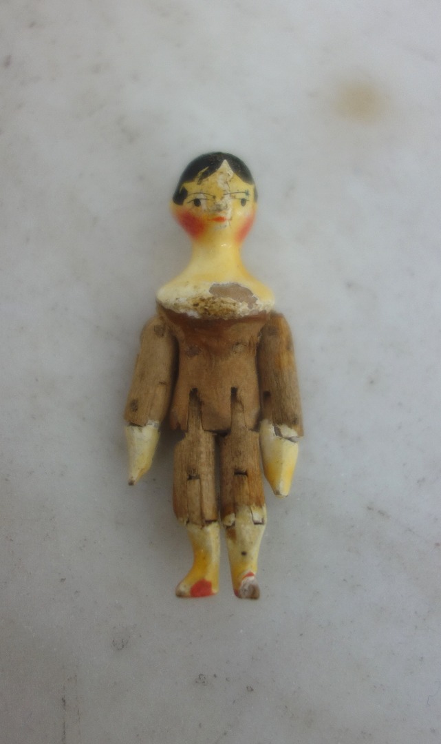 Appraisal: A miniature wooden Grodnertal doll Penny Peg doll th century