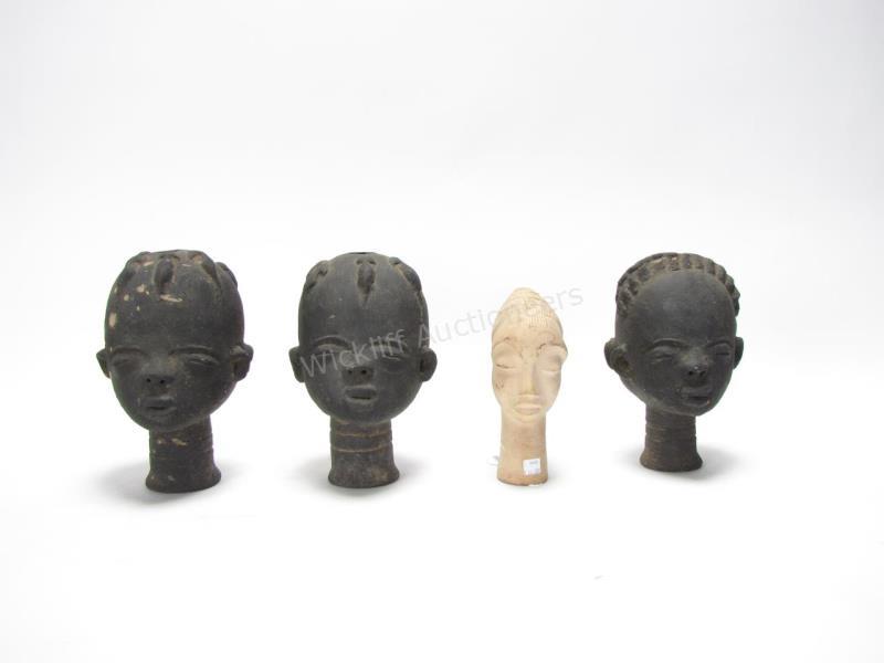 Appraisal: A pair of African tribal two-face clay head figures h