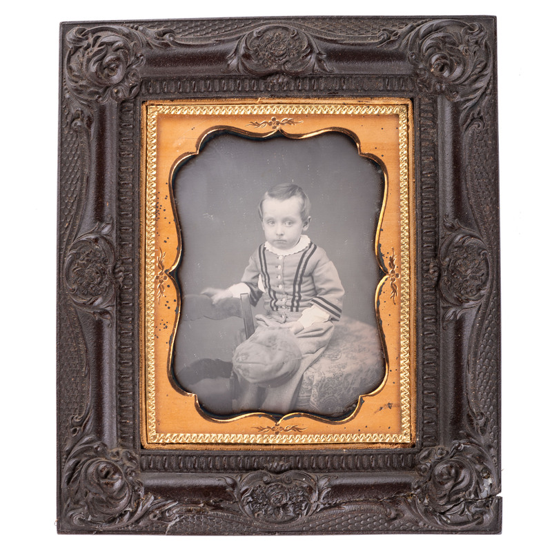 Appraisal: EARLY PHOTOGRAPHY - PORTRAITURE Quarter plate daguerreotype of bashful young