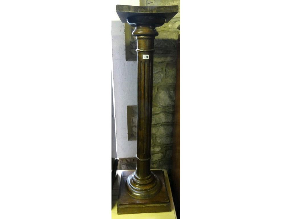 Appraisal: A stained beech wood torchere the square cut top raised