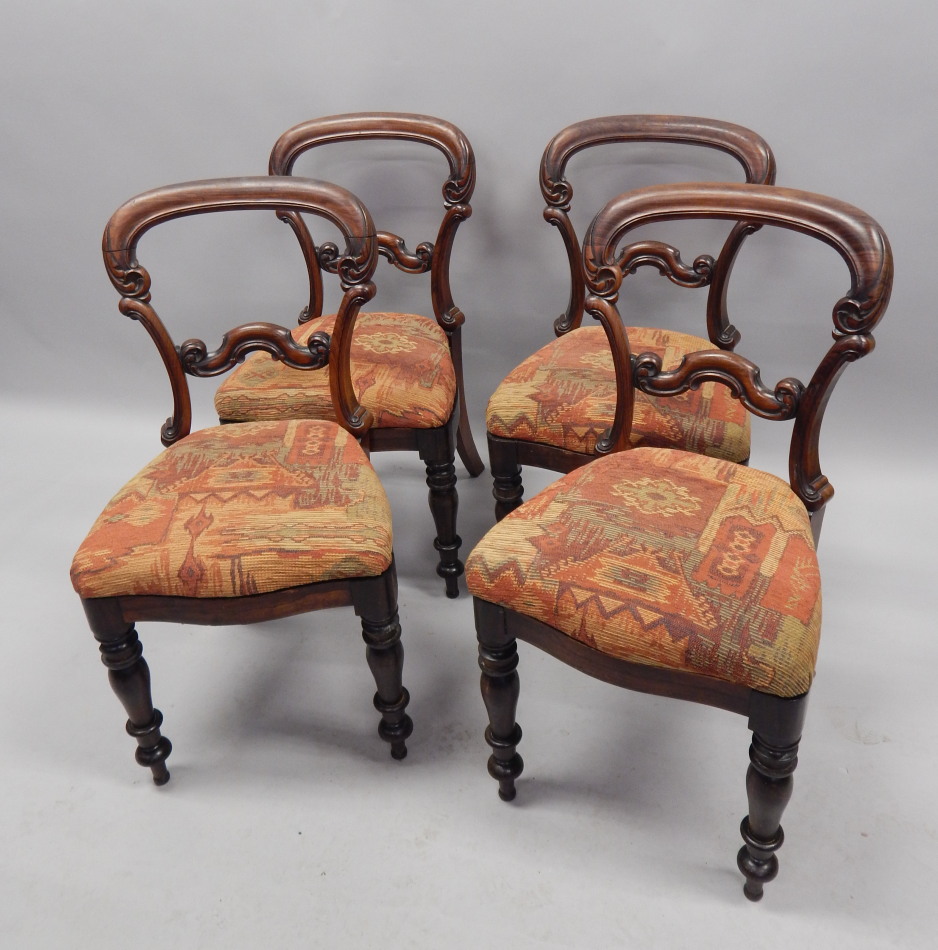 Appraisal: A set of four early Victorian rosewood balloon back dining