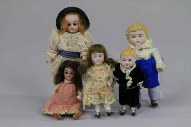 Appraisal: STEIFF GOAT AND FIVE BISQUE DOLL HOUSE DOLLS Included is