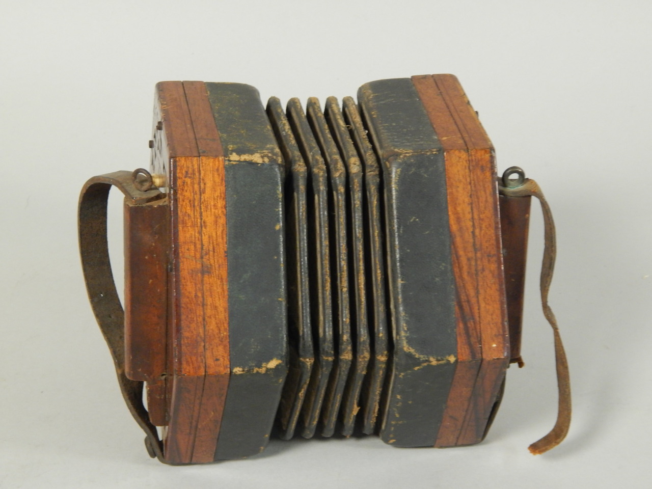 Appraisal: A thC mahogany Lachenal concertina stamped to the handles 'Steel