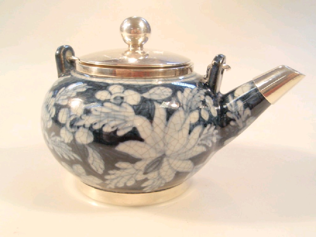 Appraisal: A small blue and white porcelain saki pot with silver