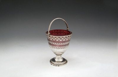 Appraisal: A George III silver swing-handled sugar basket by John Younge