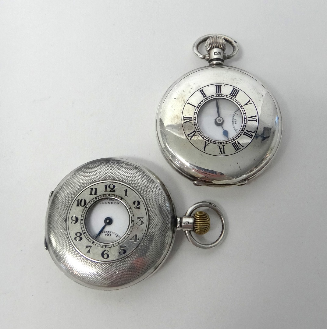 Appraisal: A gentleman's silver cased keyless wind half hunting cased pocket