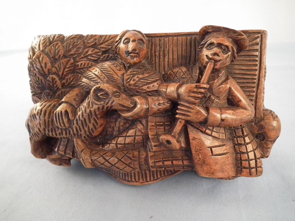 Appraisal: CARVED SCOTTISH TOBACCO BOX th century elaborately carved Scottish wood