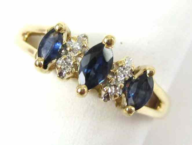 Appraisal: SAPPHIRE DIAMOND AND TEN KARAT GOLD RING set with three